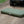 Durable 40D nylon Basecamp Mattress lying directly on rough dirt trail in front of an off-road truck