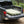 Basecamp Mattress self-inflating camping mattress inflated in a pickup truck bed at a forest campsite